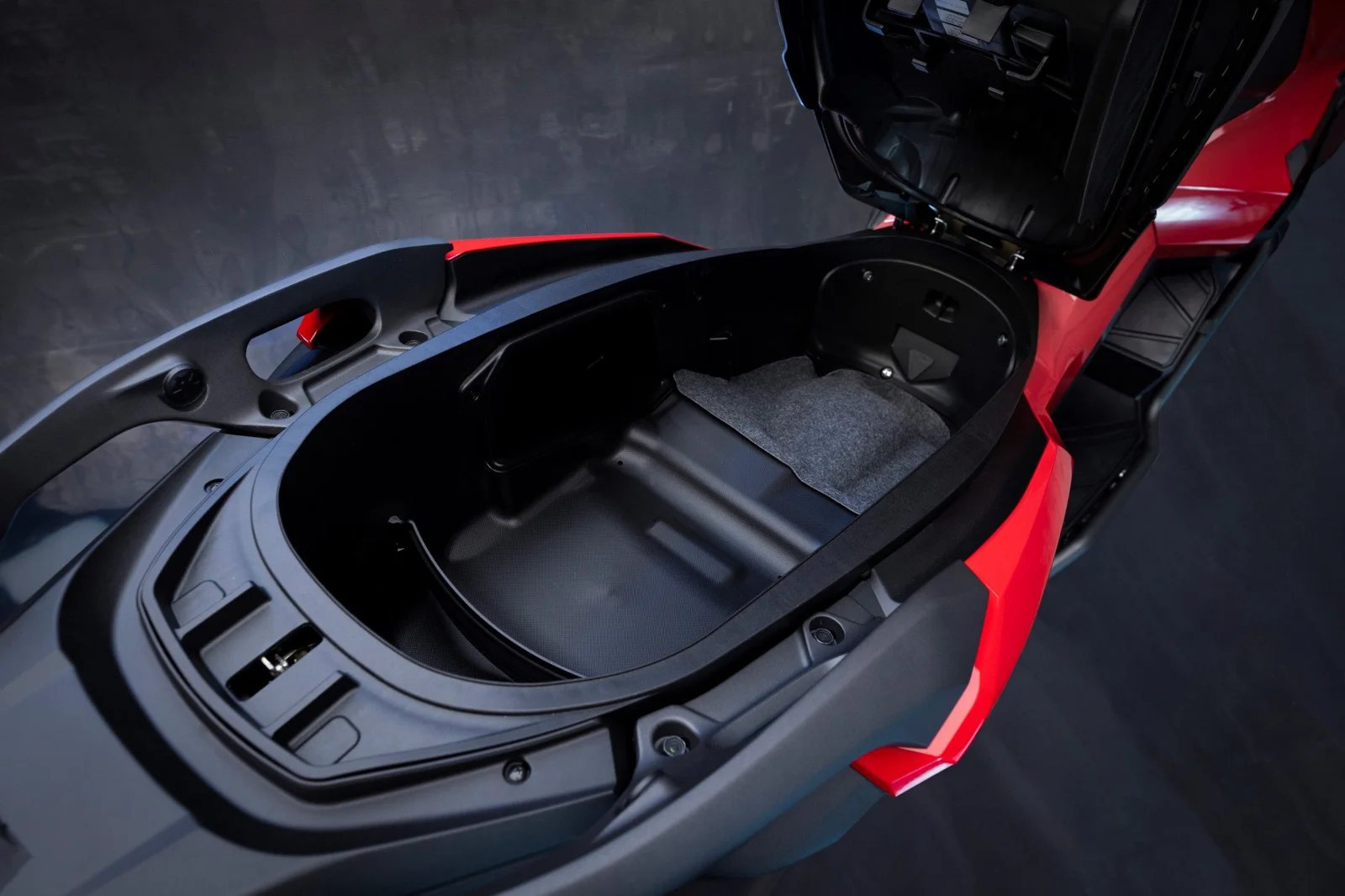 Honda ADV350 under-seat storage compartment, open