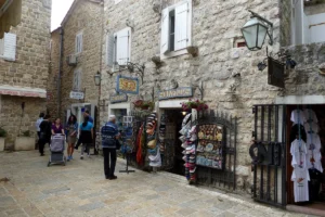 Shops and visitors in a narrow street of Budva's old town